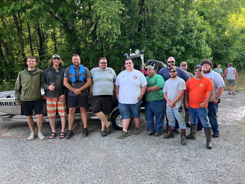 Josh Parks and Eric Wahr, who found themselves in an emergency during the weather over the holiday weekend, are shown with Emergency Management Director Mike Keltner, Brandon Harvey, Dustin Posey, Patrick Scott, Nathan Burns, Dennis Rowe, Roger Firkins, Boo Wheat and Grant Loy, all of whom participated in some way in the rescue.