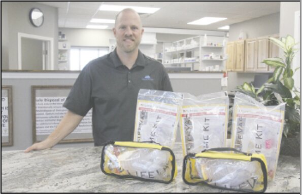 Matt Jackson is shown with the LifeVac devices currently available at Columbia Pharmacy.