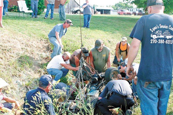 crews-lefting-up-mower
