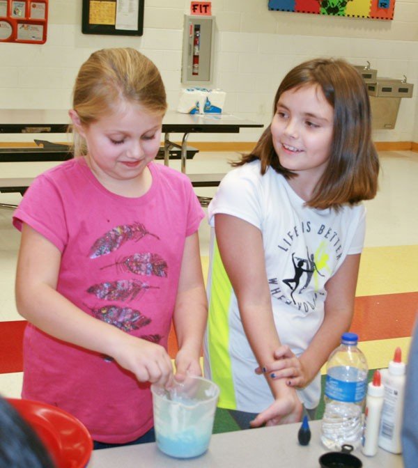 Lauren Grant and Tristan Burton made the slimy compound Gak for their science fair entry Thursday evening at Adair County Elementary School’s STEM Night.