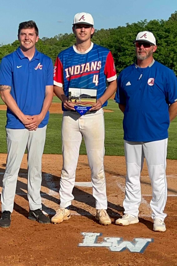Athletics director Tyler Maskill (left) and head coach Ryan McQueary (right) honored Brayton Coomer for his new school record of 30 home runs.