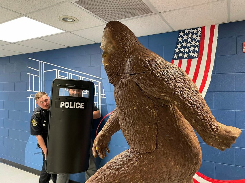 Officer Tyler McKinney and Officer Travis Bell defend themselves against Big Foot.