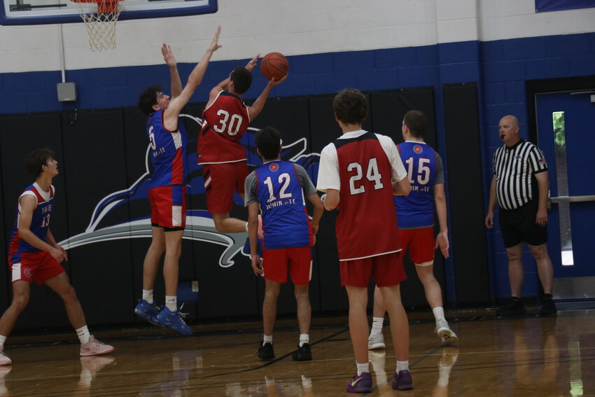 Landon Blakey blocks a shot at the Lindsey Wilson Shootout.