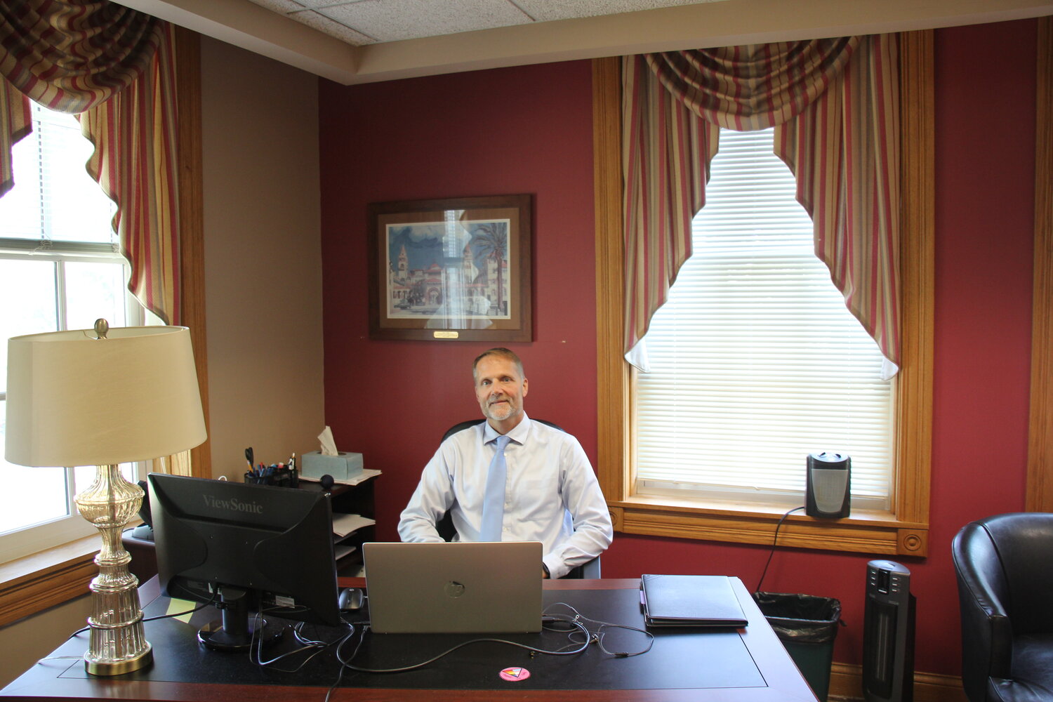 The newly hired Vice President of academic affairs, Ray Lutgring, works hard in his office to oversee all the faculty at six different campus locations.