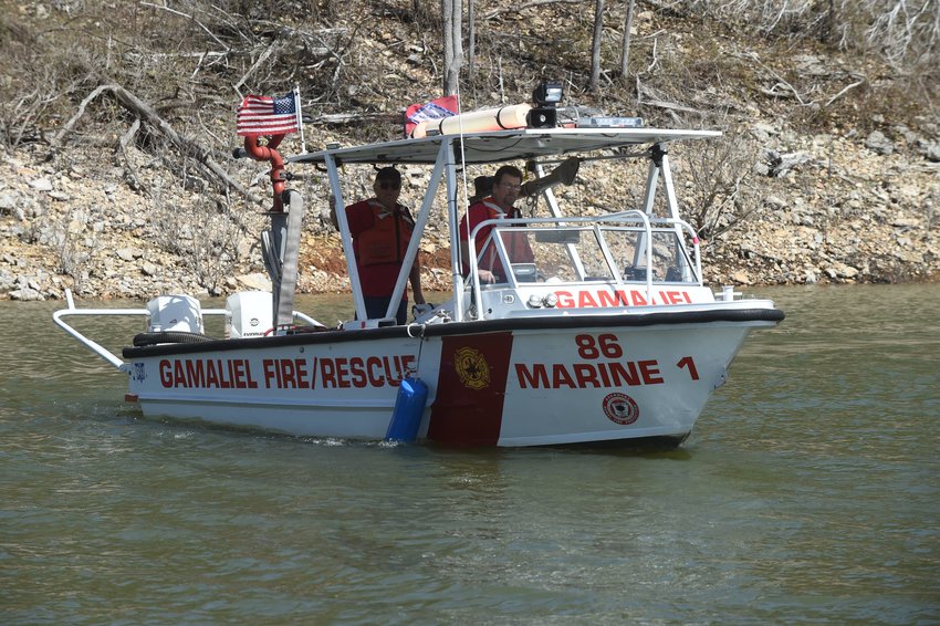 101 Gamaliel Volunteer firefighters Erich Wolf, left, and Sidney &amp;quot;Man&amp;quot; Marchand bring the department's boat into a local marina. The boat recently got several upgrades.