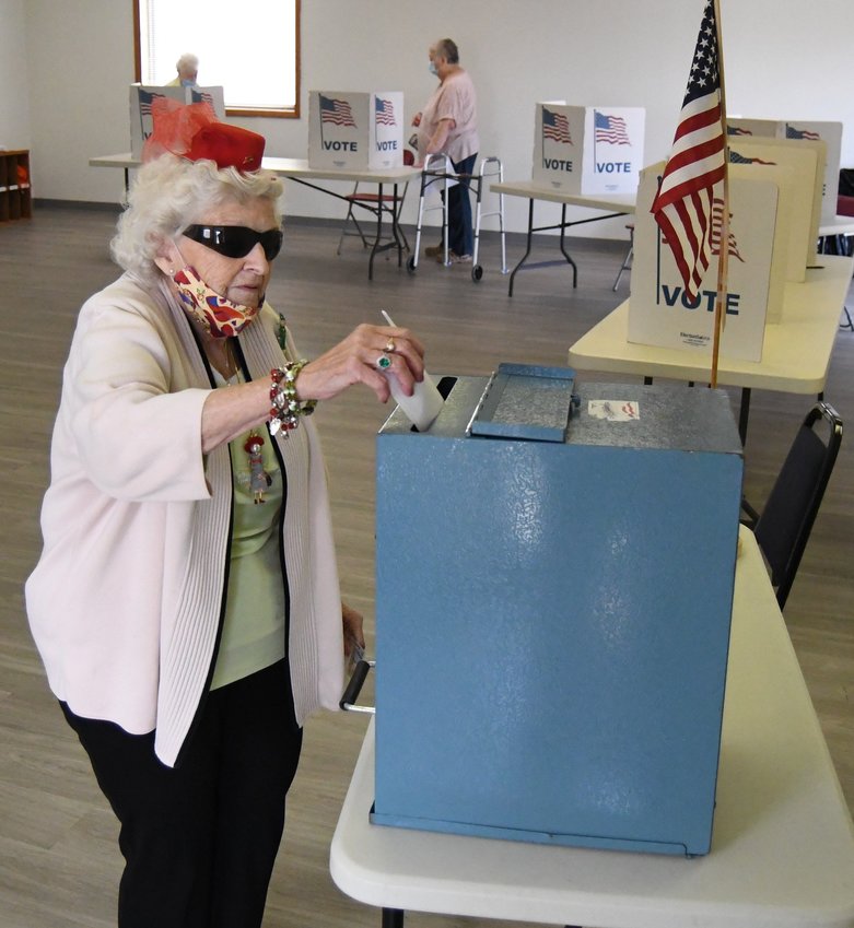 Maryann Hoyne casts her ballot Tuesday at the Baxter County Election Commission office in Mountain Home's special election on whether to adopt two sales tax proposals to improve its parks.