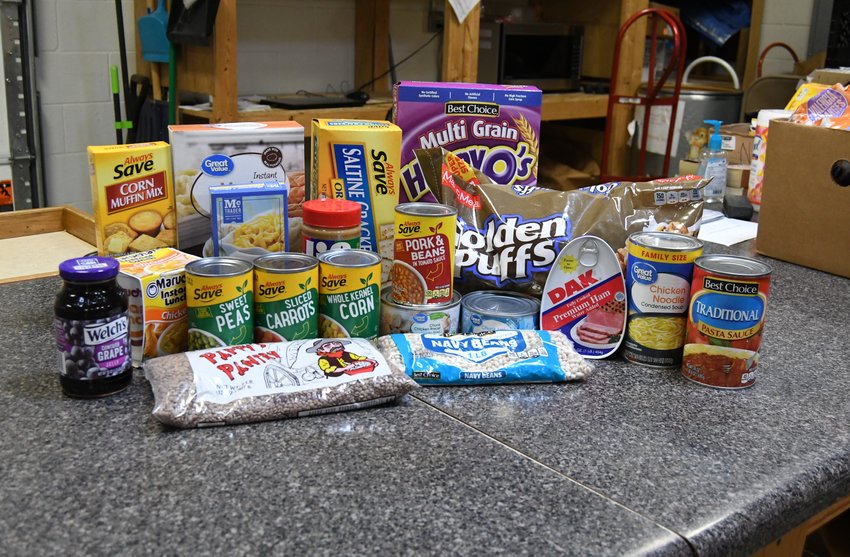 Popular items distributed to clients at the Mountain Home Food Basket are seen on a counter top recently in the facility's storeroom area. The Food Basket will hold a month-long online food drive in September in recognition of its 35th anniversary.