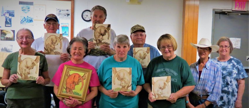 Members of the North Arkansas Woodcarvers Club recently conducted a Pyrography Class. Participants include: (first row)Nancy Smith, Lynn Huett, Sherry Valentine, Amy Wainscott, Pam Frost, instructor Myrna McCurley; (second row) Elmer Tankerley, Terry Muth and Bob Axel.