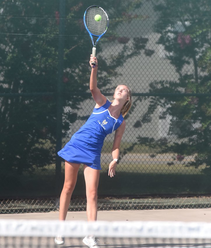 Mountain Home's Cambelle Lance serves during a recent match. Lance and Micaela McLean won the 5A-West doubles championship on Tuesday in Russellville.