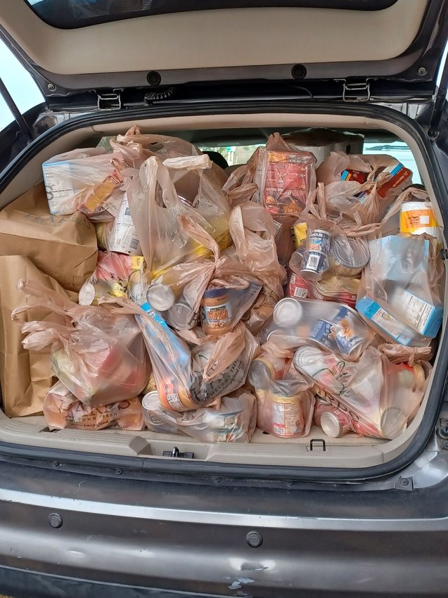 The back of Mary Ritter's vehicle is full of donated items for Pantry at the Post at American Legion Post 52, 717 Market St.