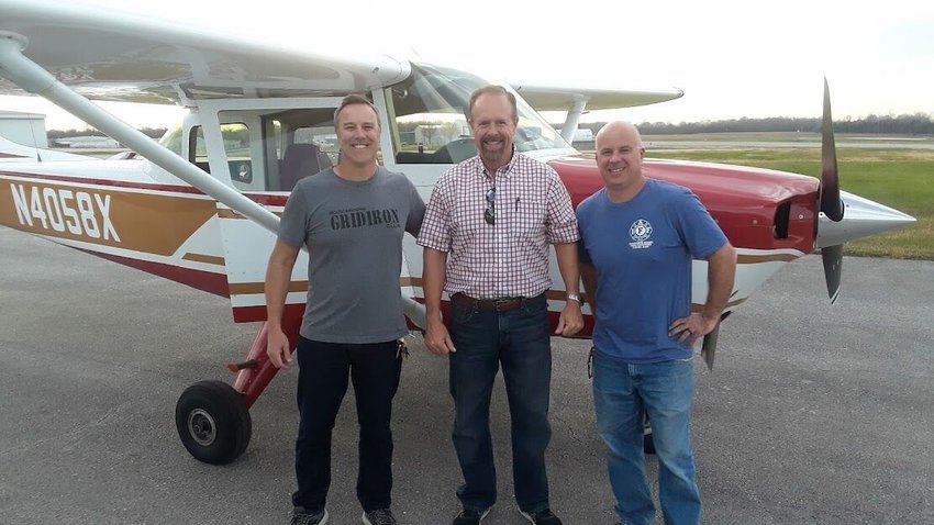 New pilots Jay Chafin (left) and Bob Harris (right) celebrate new pilot privileges with Kevin Crawford that they recently earned with support from the Leading Edge Aviation Foundation at Baxter County Airport.