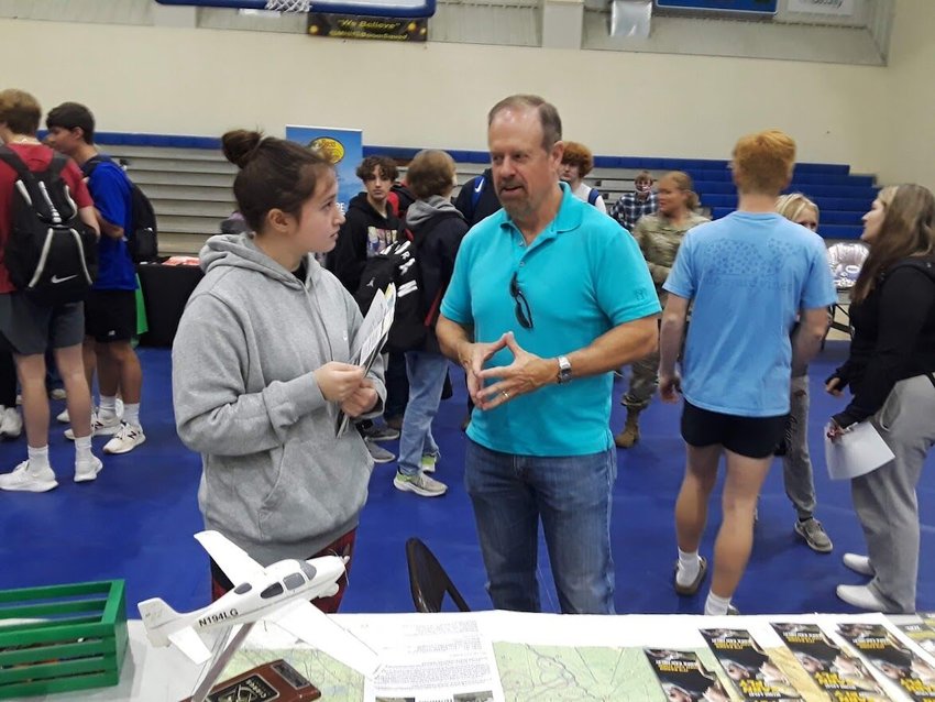Kevin Crawford, Leading Edge Aviation Foundation flight instructor, discusses aviation careers with student Helen Sampson at the recent Mountain Home High School Career Day Expo.