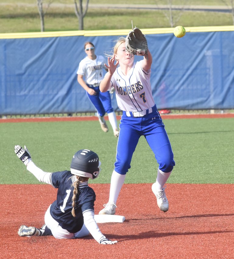 Mountain Home's Brooklyn Arms takes a throw at second base during a recent game. The Lady Bombers swept Alma on Tuesday to clinch a state tournament berth.