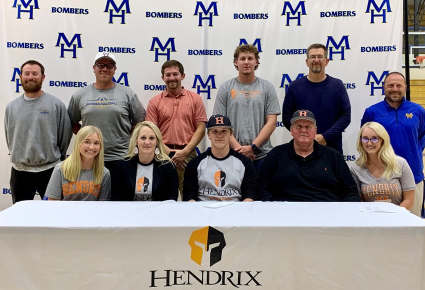 Mountain Home's Trent Jordan (front, center) signed Thursday to play baseball at Hendrix College in Conway. The Warriors, coached by R.J. Thomas, compete in NCAA's Division III and currently own a 29-15 record.