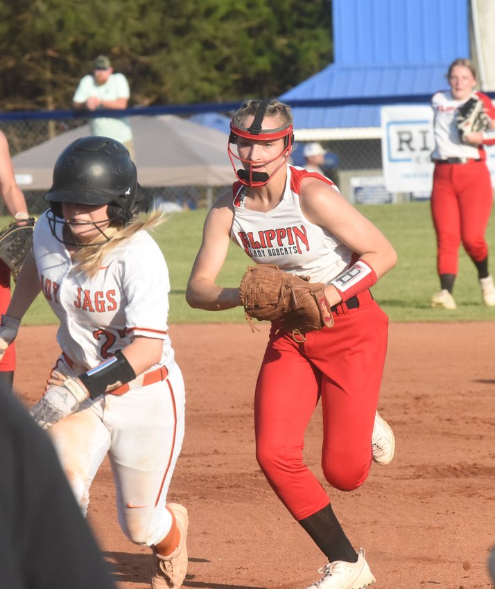 Flippin's Ella Alexander runs down a baserunner during the Lady Bobcats' loss to McCrory on Thursday.