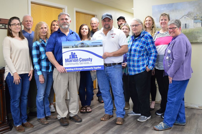 Marion County Judge John Massey recently presented a $50,000 donation to the Marion County Community Center Project on behalf of Linda Chris Smith. Linda Smith made the donation in memory of her husband, Christopher Frederick Smith.   Submitted photo