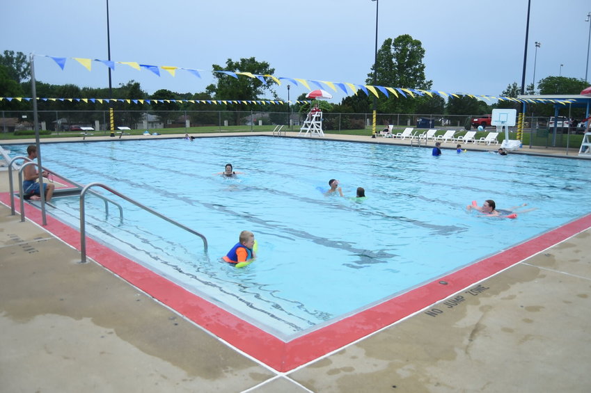 Patrons of the Mountain Home City Pool take a dip in the water at the start of Tuesday's open-swim session. The city's pool reopened on Memorial Day and will remain open through Labor Day.   Scott Liles/The Baxter Bulletin