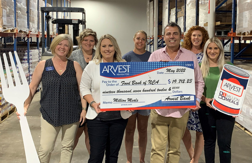 Personnel from Arvest Bank recently presented a check for $19,712.23 to the Food Bank of North Central Arkansas as part of the 2022 Million Meals campaign.   Submitted Photo