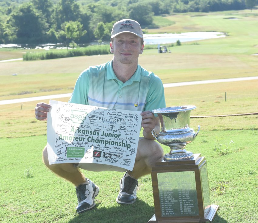 Rhett South, a Farmington High School graduate, poses with the Walter Davis Trophy after winning the Arkansas Junior Amateur Championship on Wednesday at Big Creek Golf &amp; Country Club.