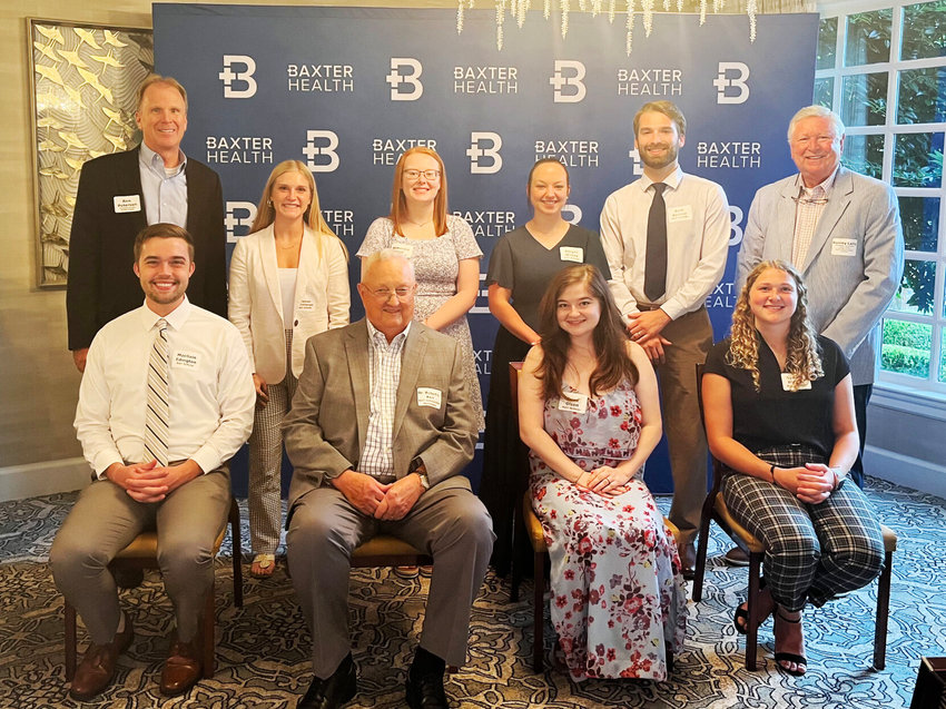 Those attending a recent ceremony to award 2022 Kerr Scholarships are (first row, from left) Macllain Edington, Dr. Robert L. Kerr, Erica Olson and Sydney Blevins; (second row) Baxter Health President and CEO Ron Peterson, Madison Hershberger, Makenzie Cole, Abigail Wilkie, Reid Barrow, and Baxter Health Vice President/Business Development and Foundation Executive Director Barney Larry.&nbsp;   Submitted Photo