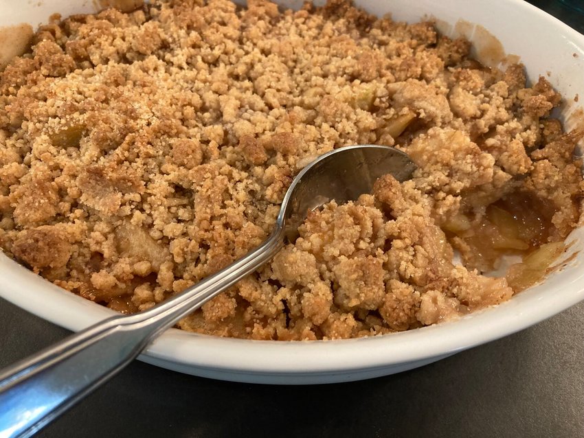 Apple crumble, where tart apples are baked under a crumbly&nbsp;topping, is a delightful late-summer dessert.   Bulletin Photo/Linda Masters