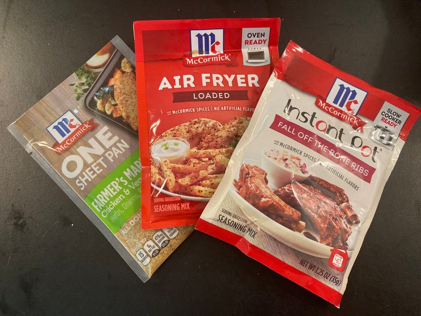 Three ready-to-use McCormick seasoning packets can make cooking fasters and easier. Shown are (from left) Sheet Pan, Loaded seasoning for the air fryer and Fall Off the Bone Ribs for an instant pot or slow cooker.   Linda Masters/The Baxter Bulletin