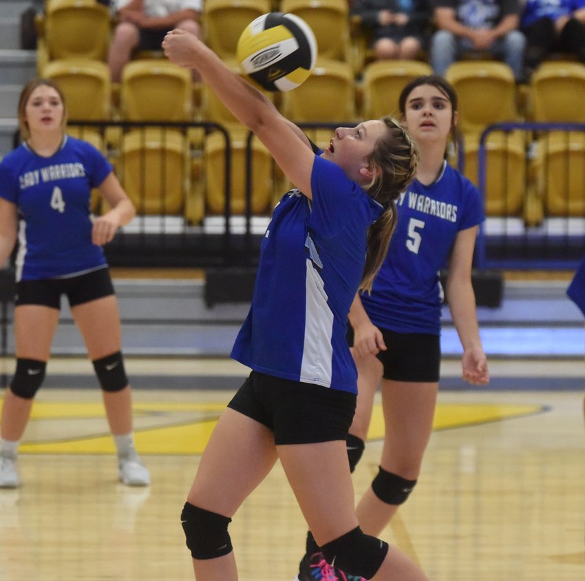 Cotter's Gracyn Jackson passes during district tournament action at Quitman. Also pictured are Zaylor Brotherton (4) and McKenna Collins (5).