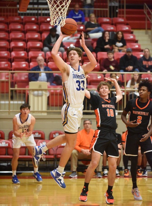 Mountain Home's Braiden Dewey goes up for two against Waynesville, Mo., Thursday night at Branson, Mo.