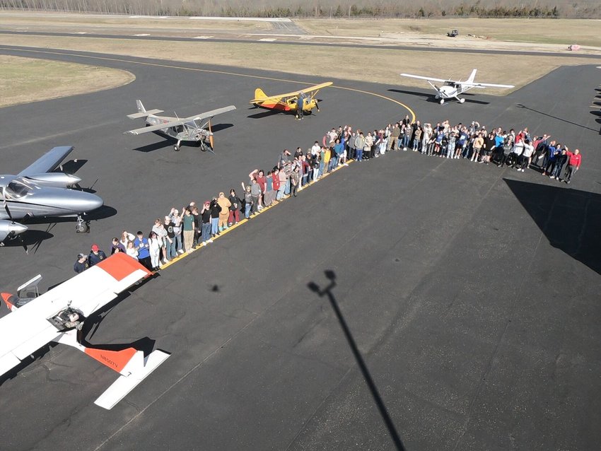 Leading Edge Aviation Foundation pilots are shown with the MHHS Bomber sophomore class, teachers and five of the aircraft displayed during the students' visit to the Baxter County Airport this week.&nbsp;   Submitted Photo