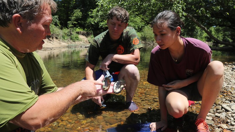 Arkansas Game and Fish Commission Malacologist Kendall Moles teaching students about freshwater mussels. Area college students interested in summer internships with the AGFC have until March 31 to apply.   Submitted Photo