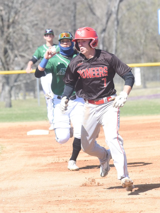 Arkansas State University-Mountain Home second baseman Sammy Lemond chases a North Arkansas College player in a rundown as shortstop Josh Prinner (back) waits at second base Friday at Cooper Park.
