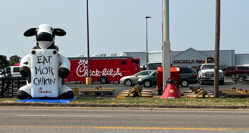 While Chick-fil-A&rsquo;s original mascot was &ldquo;Doodles&rdquo; the chicken, the &ldquo;Chick-fil-A cows&rdquo; have been a symbol of the fast food chain for several decades. The cows, like this blow up the parking lot of Orscheln Farm and Home, located at 1025 Hwy. 62 East, will routinely hold signs encouraging diners to &ldquo;eat mor chikn.&rdquo;   Helen Mansfield/The Baxter Bulletin