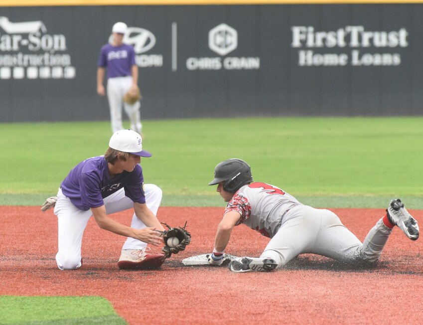 North Central Arkansas shortstop Rhett King attempts to tag Paragould's Kayson Becker as he steals second base Friday in state tournament play at Conway.