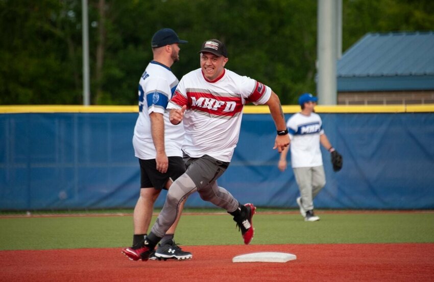 Mountain Home firefighter and EMT Tommy Feliccia rounds second base during the second annual MHPD vs. MHFD charity ragball game Saturday night at Freedom Field in McClain Park.   Photo Courtesy of Greg Ifland