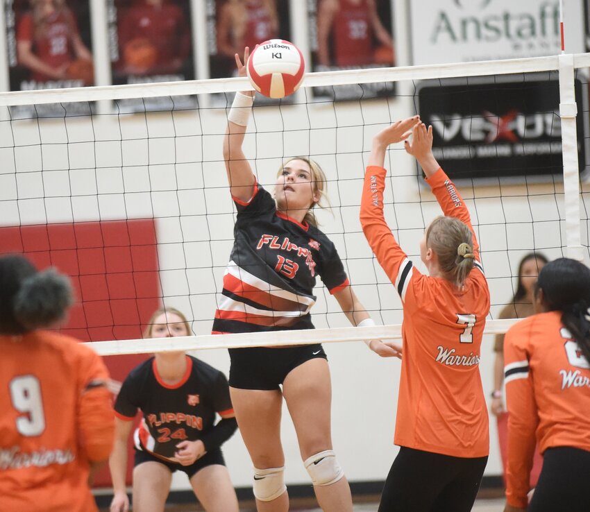 Flippin sophomore Abbi Davis hits for a point against Little Rock Hall on Monday.