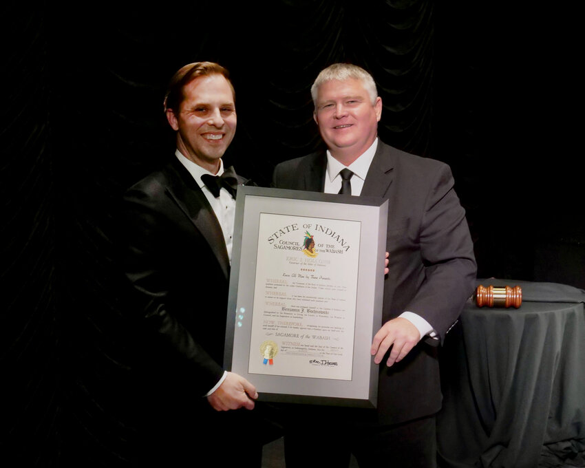 Tom Fite (right), director of the Indiana Department of Financial Institutions, presents Benjamin J. Bochnowski with the Sagamore of the Wabash award at the Indiana Bankers Association’s Annual Convention in French Lick, Ind.