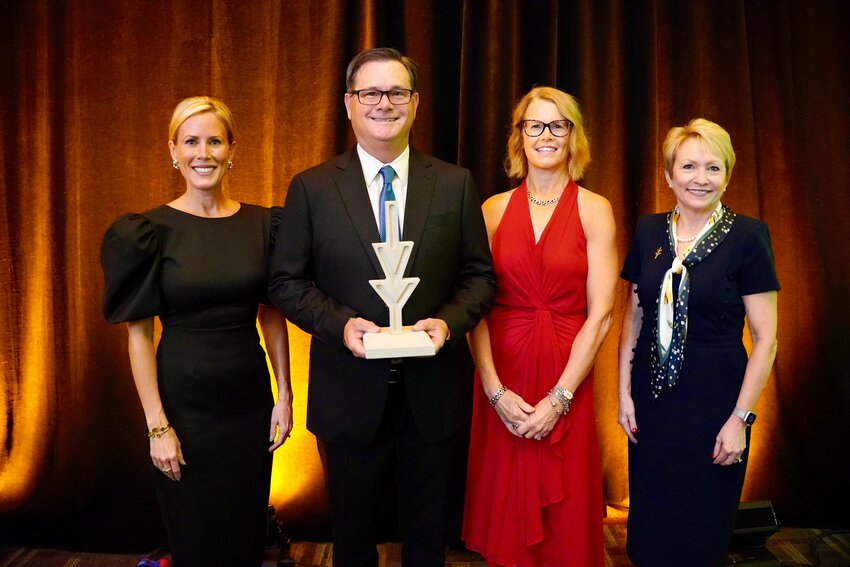 Ivy Tech Kokomo Benefactors of the Year recipients Rex Gingerich (second from left), founder and CEO of Chariot Automotive Group,  and Lisa (Gingerich) Hearn (third from left), vice president of administration for the company, are pictured with Courtney Roberts (left), president of the Ivy Tech Foundation, and Dr. Sue Ellspermann, president of Ivy Tech during the awards gala in Indianapolis.