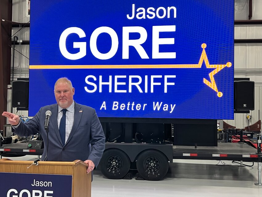Jason Gore, ATF Assistant Special Agent in Charge (Retired), announces his candidacy for Lake County Sheriff during a press conference Thursday at the Sage-Popovich, Inc. Aircraft Operations Hangar in Gary.