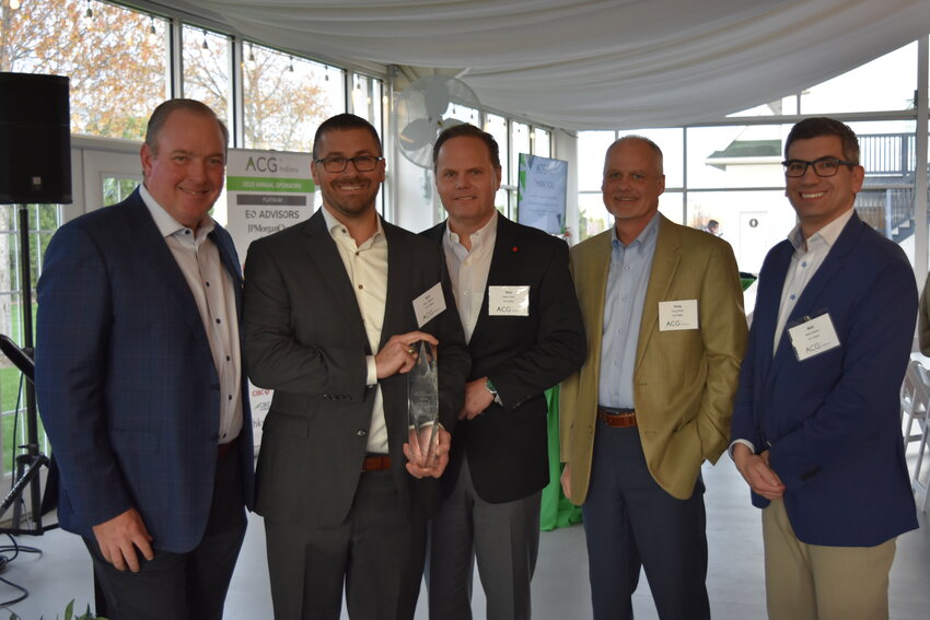 From left, True Value President Dent Johnson, Do it Best President Nick Talarico, Do it Best VP of HR and General Counsel Gary Furst, Do it Best VP of Finance and CFO Doug Roth, and True Value VP of Finance Matt Saines accept the ACG 2024 Deal of the Year Award (Large Cap) for Indiana.