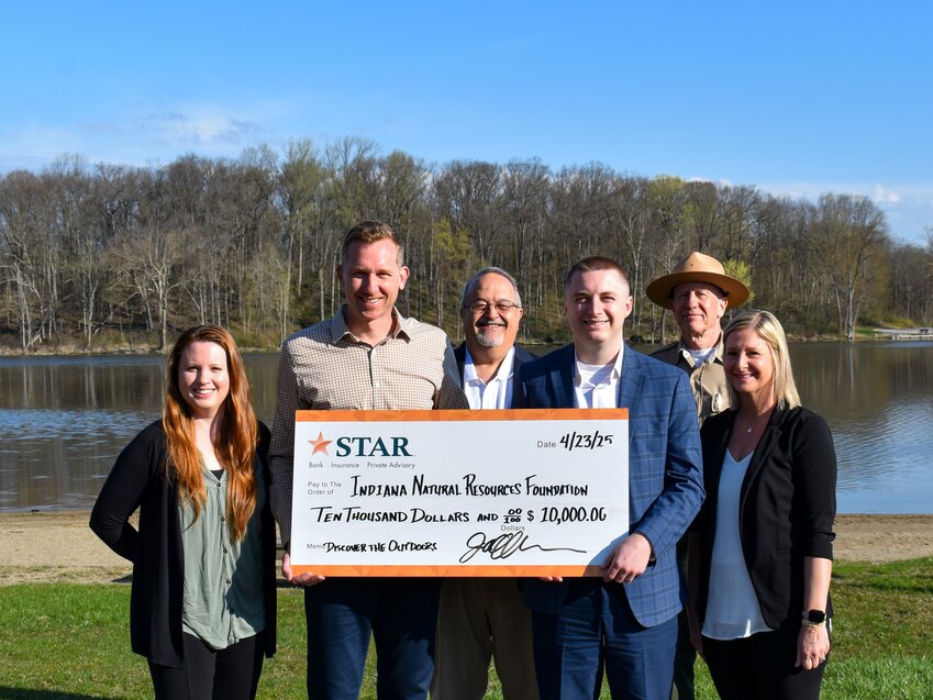 STAR Financial Bank team members Karissa Shaffer, Trevor Smith, David Smith, and Stephanie Walpole present a $10,000 check to support the Discover the Outdoors program. Also pictured: Todd Wenninger, Indiana Natural Resources Foundation Development Coordinator for Northern Indiana, and Sam Boggs, Chain O' Lakes State Park Property Manager.