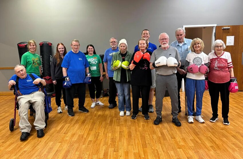 Reid Fitness team members join Rock Steady Boxing Headquarters and Connersville participants for their final class under Reid Health. The program, now Punching Out Parkinson's Connersville, will continue at Crosspointe Biker Church under Nancy Hinds and new head coach Tara Madden.