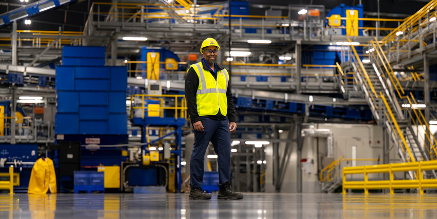 An employee poses for the camera at the Polymer Center-Blue Polymers facility in Indianapolis.