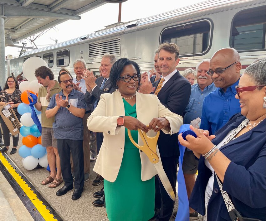 Michigan City Mayor Angie Nelson Deuitch cuts the ribbon during the grand opening of the 11th Street Station and garage.
