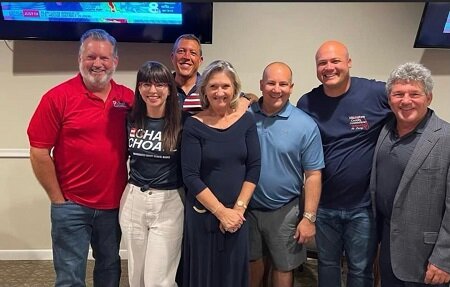 County Administrator Scott Hopes attends an August 23 primary election night gathering at the Palm Aire Country Club with candidates and some current commissioners. Left to Right: county commission candidates Mike Rahn and Amanda Ballard, Commissioner George Kruse, Commissioner Vanessa Baugh, Commissioner Kevin Van Ostenbridge, county commission candidate Jason Bearden, and County Administrator Scott Hopes.