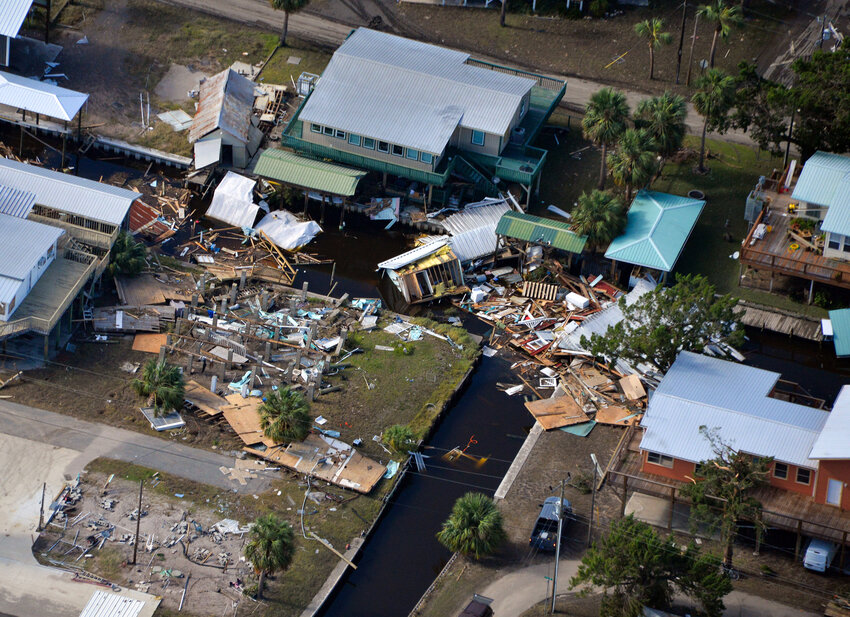 A large pile-up of storm debris is seen in a canal in Horseshoe Beach, Fla., on Thursday, Aug 31, 2023, following Hurricane Idalia’s landfall in Keaton Beach, Fla., Wednesday morning. (Caleb Ross/WUFT News)