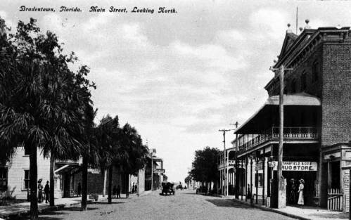 Main Street in 1912 with Warren Opera House and Stansfield Drug Store.