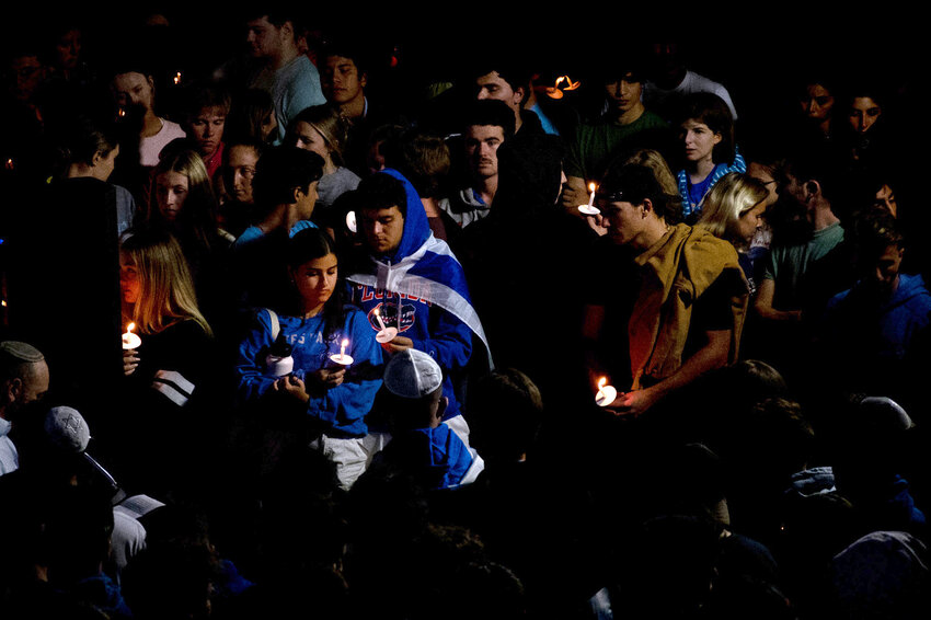 University of Florida students hold a vigil supporting Israel in Turlington Plaza before a scare caused the crowd to run for cover Oct. 9, 2023. (Augustus Hoff/WUFT News)