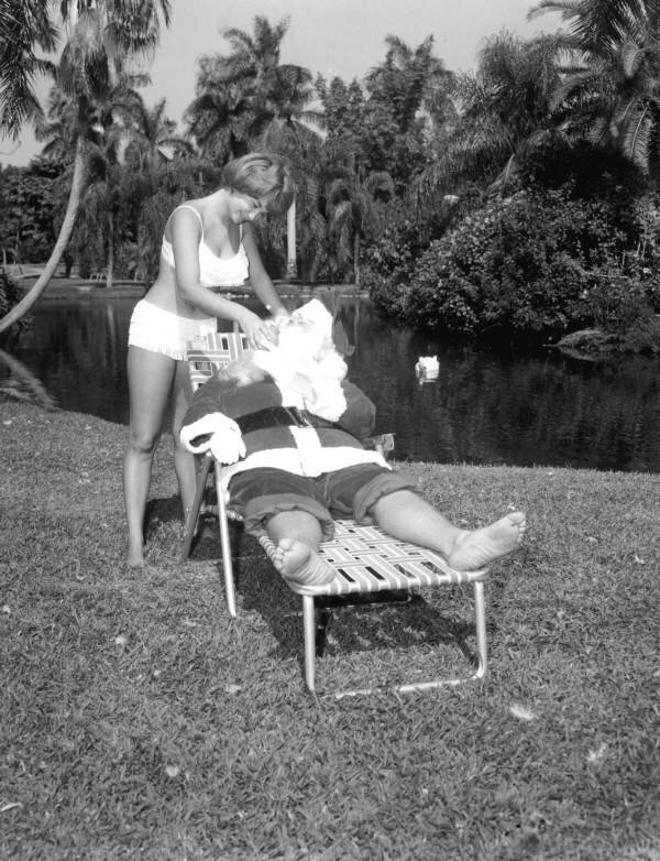 Santa lounges at Jungle Gardens for a photo shoot, circa 1958. 