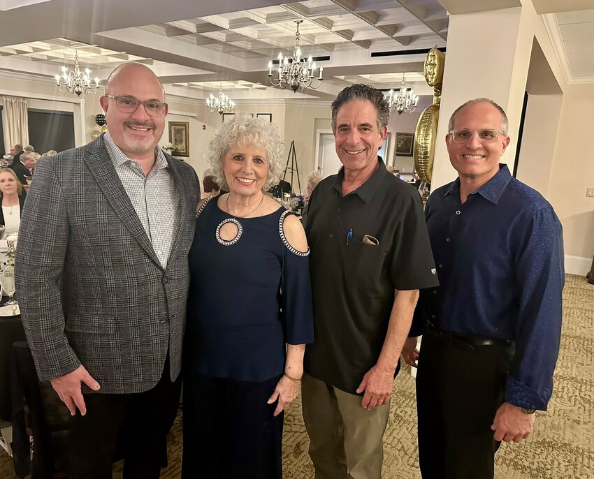 Founding member, Linda Hoffman with her brother, Frank Samson and her two sons, Larry Hoffman left and Ryan, far right.