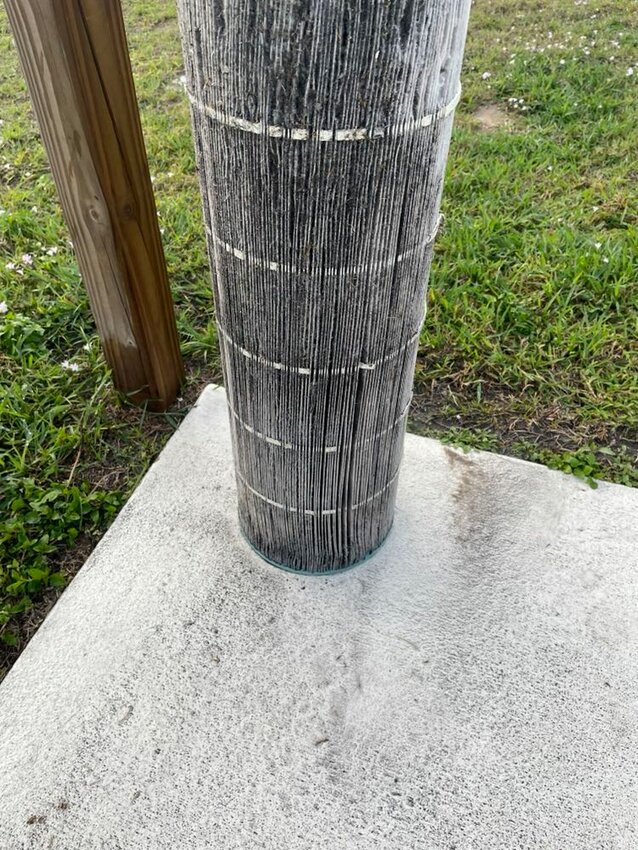 Pool filter covered in black dust from nearby development site. Photo by: Carolyn Alvarez